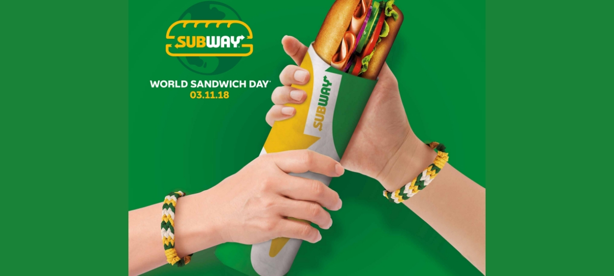 Subway s'engage avec la Banque Alimentaire Deux mains qui tiennent un sandwich