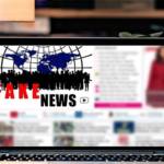 Ordinateur avec à l'écran l'inscription Fake News