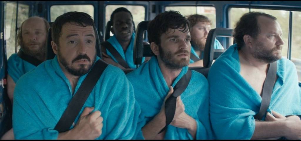Equipe de foot dans un minibus