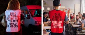 Une femme et un homme de dos avec une chasuble avec l'inscritpion suivante :on ne recule devant rien pour faire reculer le virus du sida.