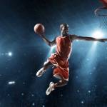Jouer ude basket en train de marquer un panier
