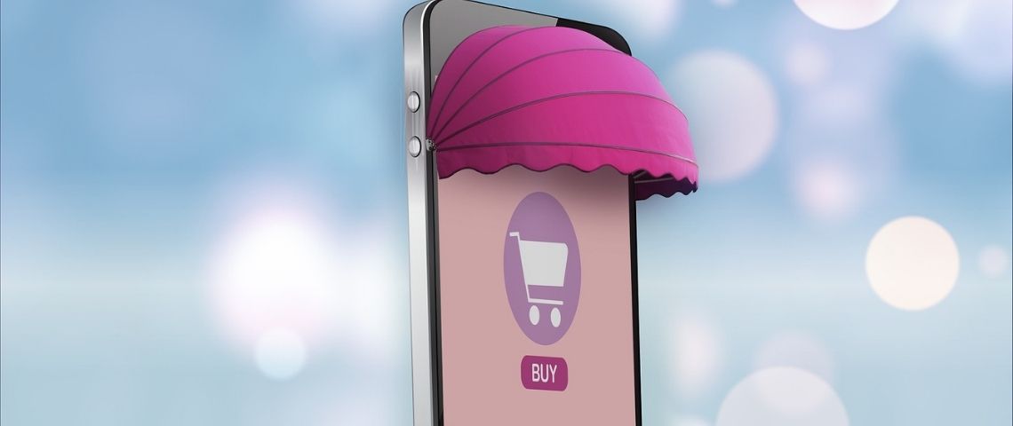 Hubside, service de création de sites internet 100 % made in France, Téléphone portable, transformé en une entrée de boutique, avec la mention BUY sur l'écran