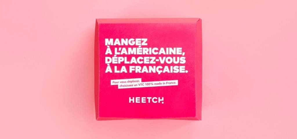 Message sur un emballage Heetch :  - Mangez à l'américaine, déplacez-vous à la francaise. Pour vous déplacer, choississez un VTC made in France