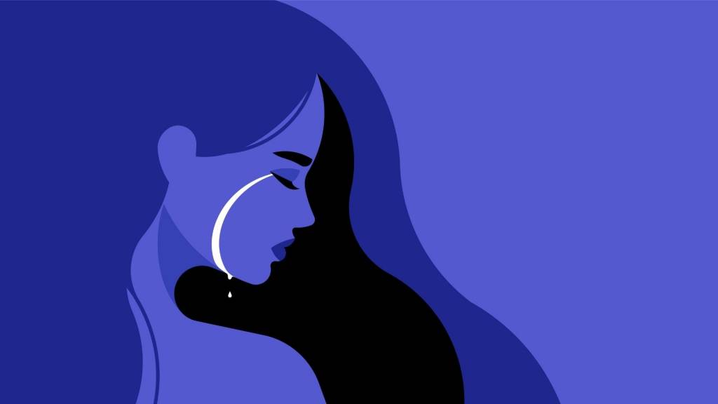 Femmes avec une larme sur la joue