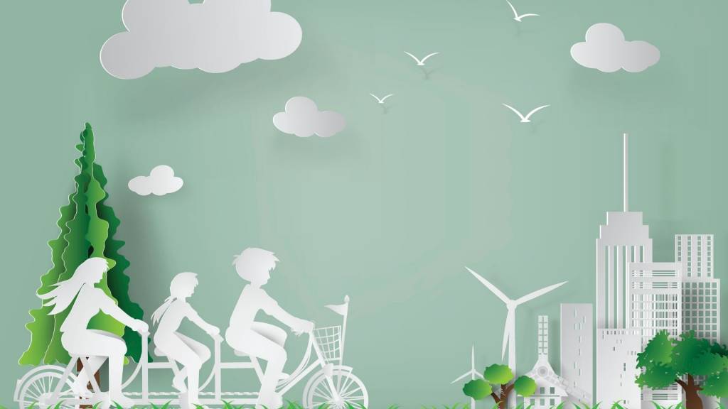 Famille faisant du vélo avec des éoliennes en arrière plan