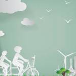Famille faisant du vélo avec des éoliennes en arrière plan