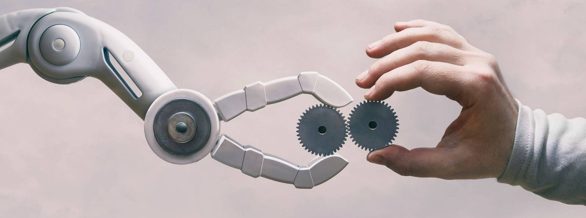 Largo automatise le processus de reconditionnement de ses Smartphones, une démarche inédite sur le marché français Robot et main humaine avec des engrenages