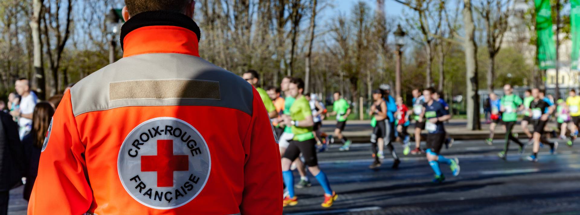 French red cross man supervising runnrers French red cross man supervising runnrers
